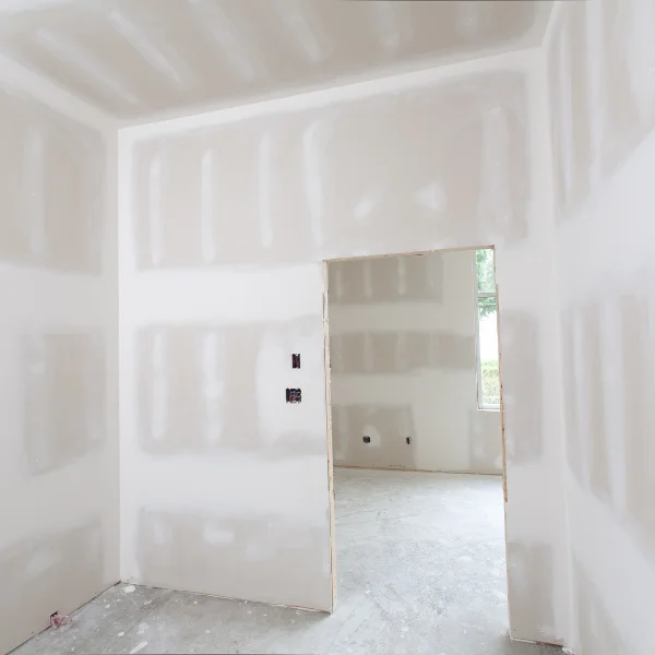 A picture showing a professional applying drywall in a Knoxville home.