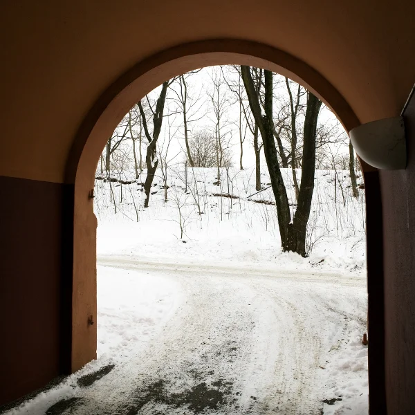 An image showing an elegant half-arch in a driveway.