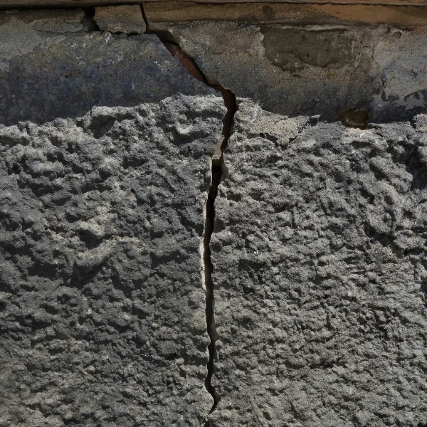 An image of a cracked foundation in need of professional masonry repair.