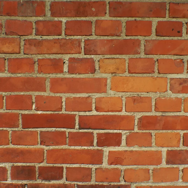 An image of a damaged brick wall showing structural integrity issues.