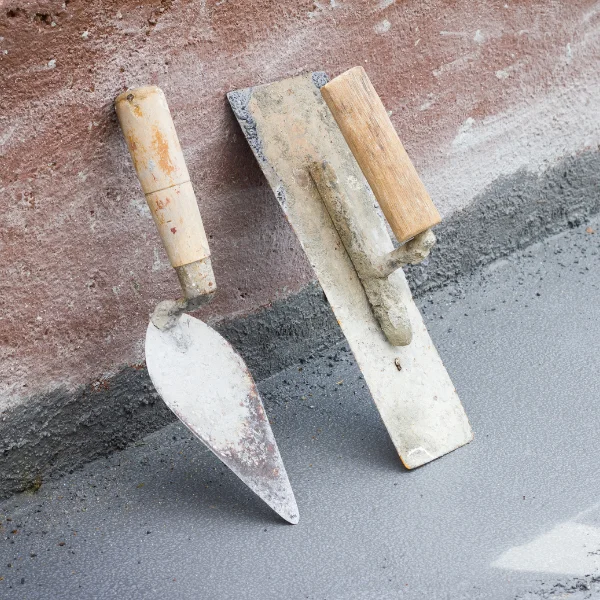 An image of various precision trowels used in masonry work.