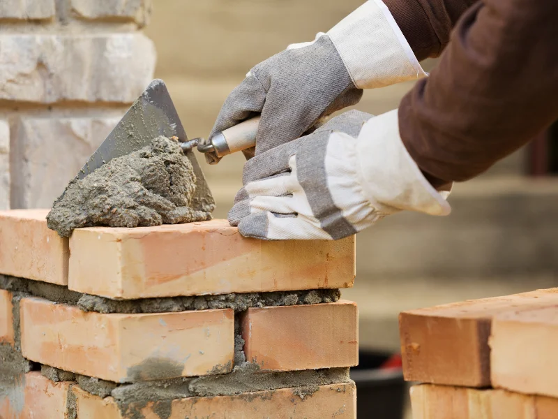 Image representing a home undergoing masonry. 