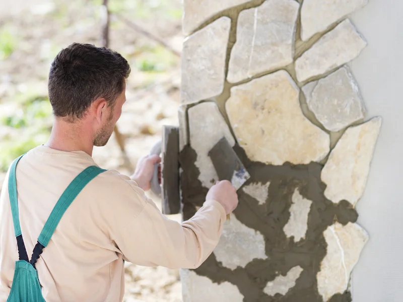 Image showing a homeowner doing DIY masonry work.