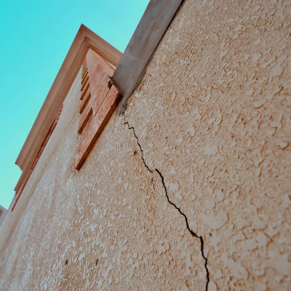 Image showing a house with cracks in the exterior wall.