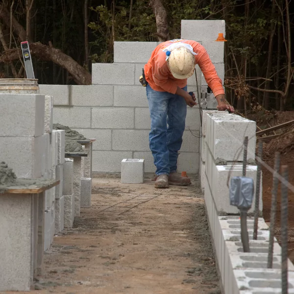 An image of a solid masonry block foundation preventing settlement and cracking.