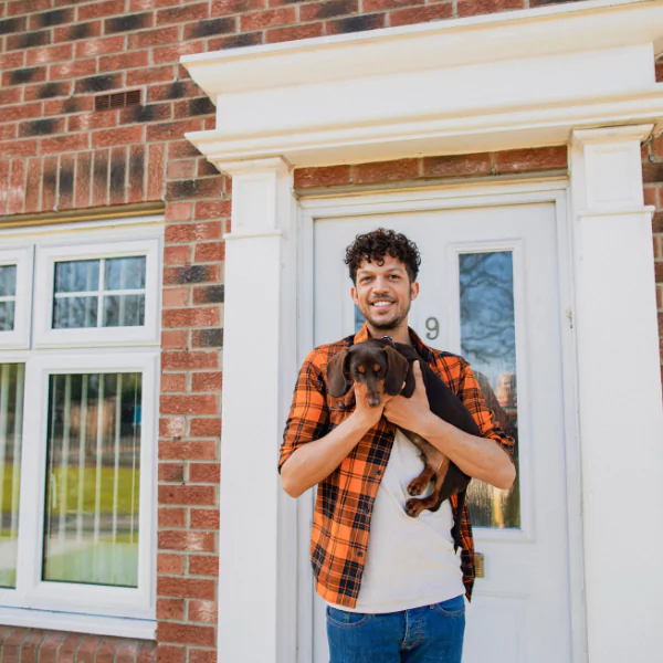 Image showing a satisfied homeowner after successful concrete wall fastening in Knoxville, TN.